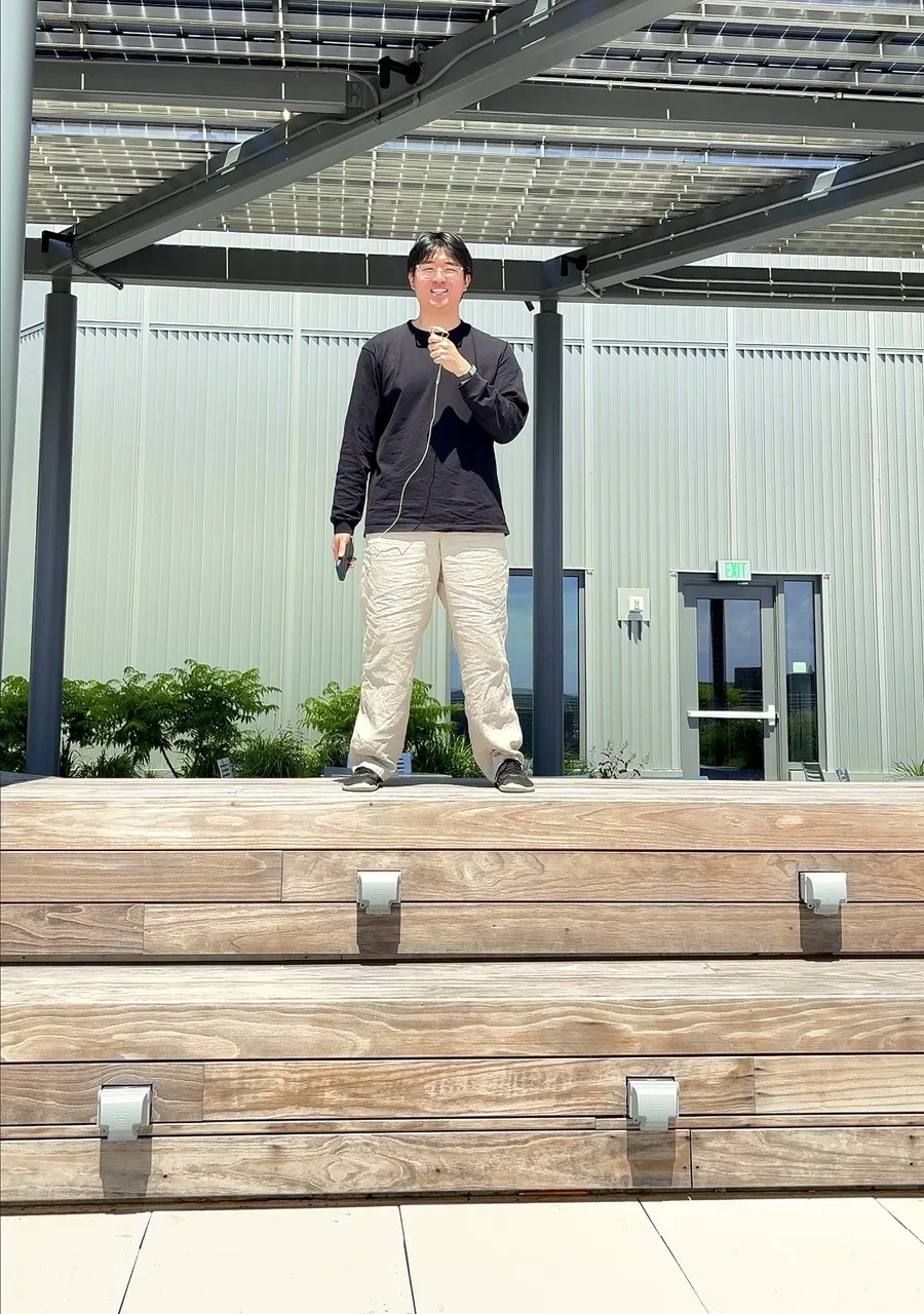 An Artify Madison team member presenting the company outdoors in Madison